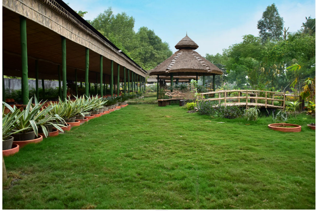 Open-air mud-and-thatch learning verandah